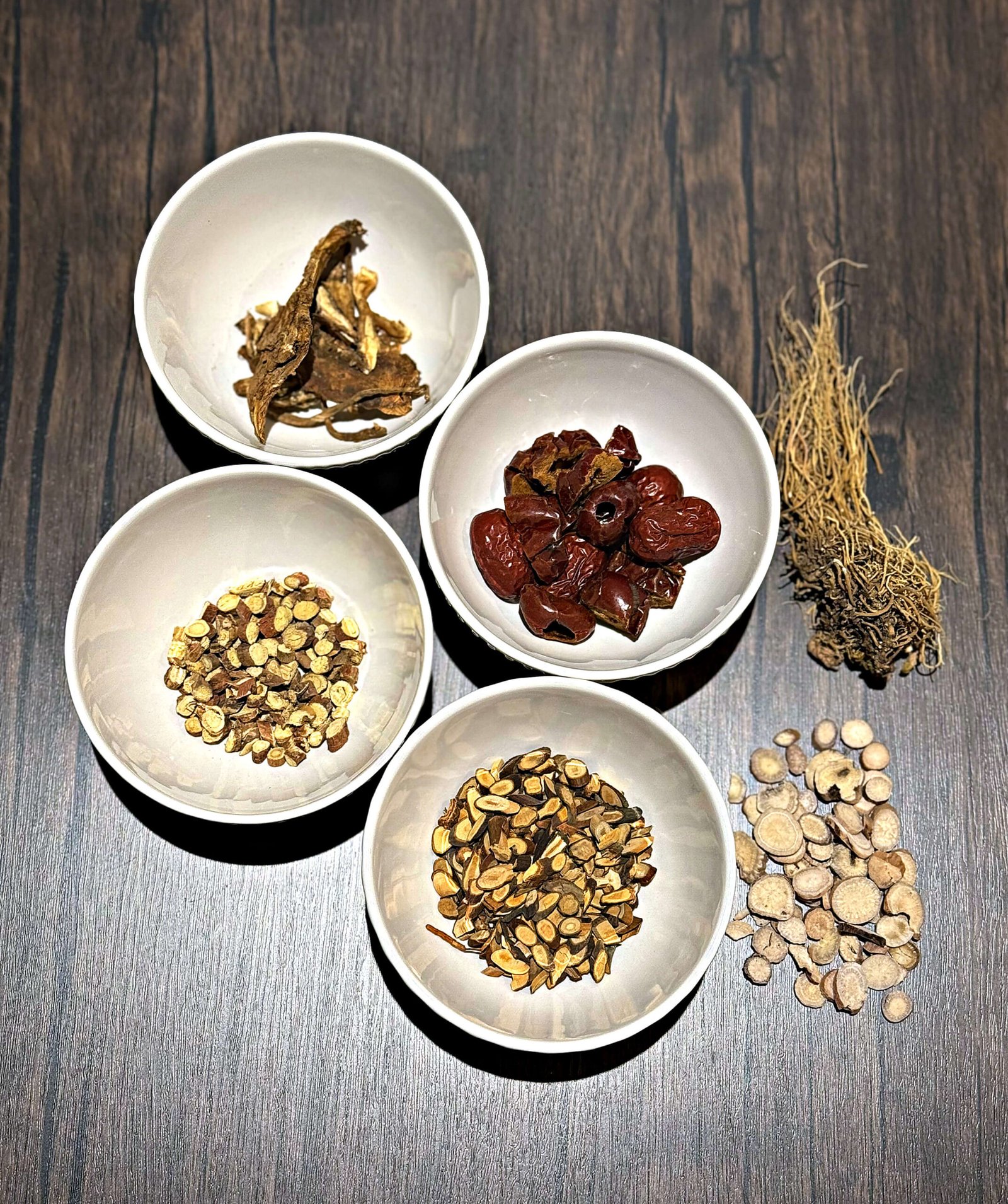 Raw Chinese herbs for a single custom herbal formula measured out before grinding